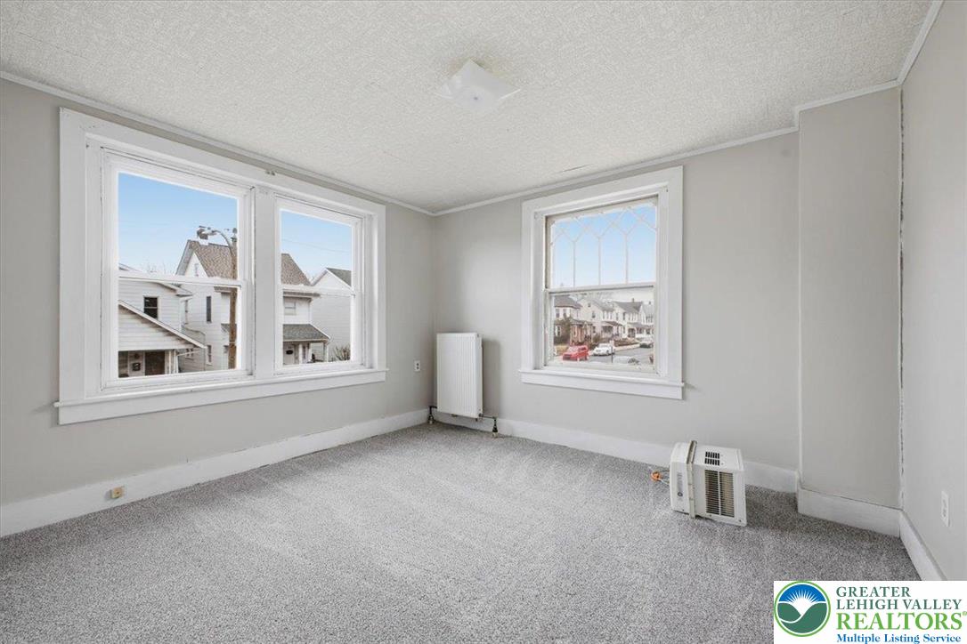 1229 Main Street Northampton, PA 18067 - Photo 23 of 24 an empty room with windows and cabinet