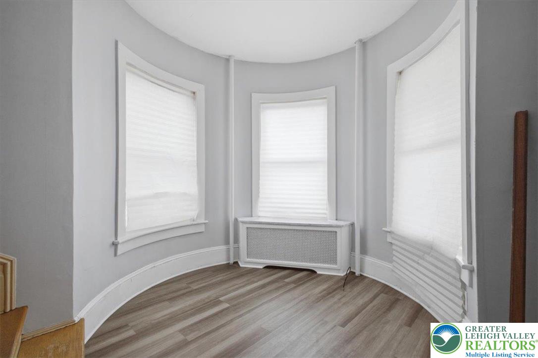 1229 Main Street Northampton, PA 18067 - Photo 5 of 24 a view of an empty room with wooden floor and a window