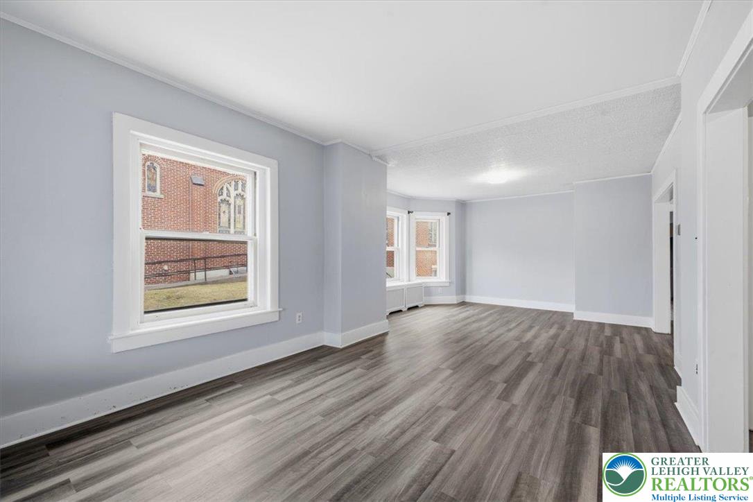 1229 Main Street Northampton, PA 18067 - Photo 6 of 24 a view of an empty room with wooden floor and a window