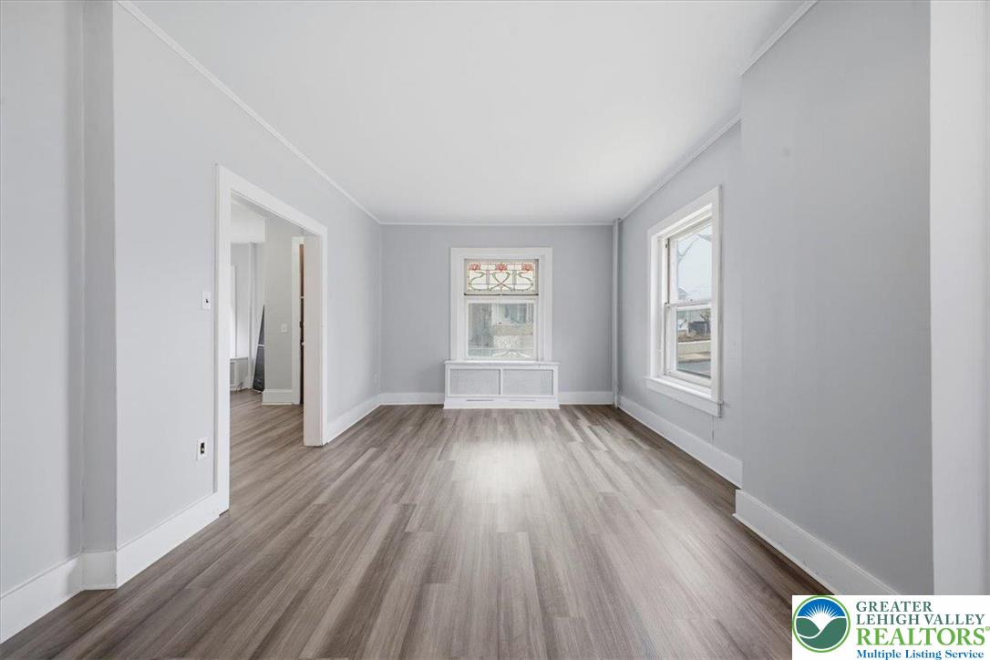 1229 Main Street Northampton, PA 18067 - Photo 8 of 24 a view of an empty room with wooden floor and a window