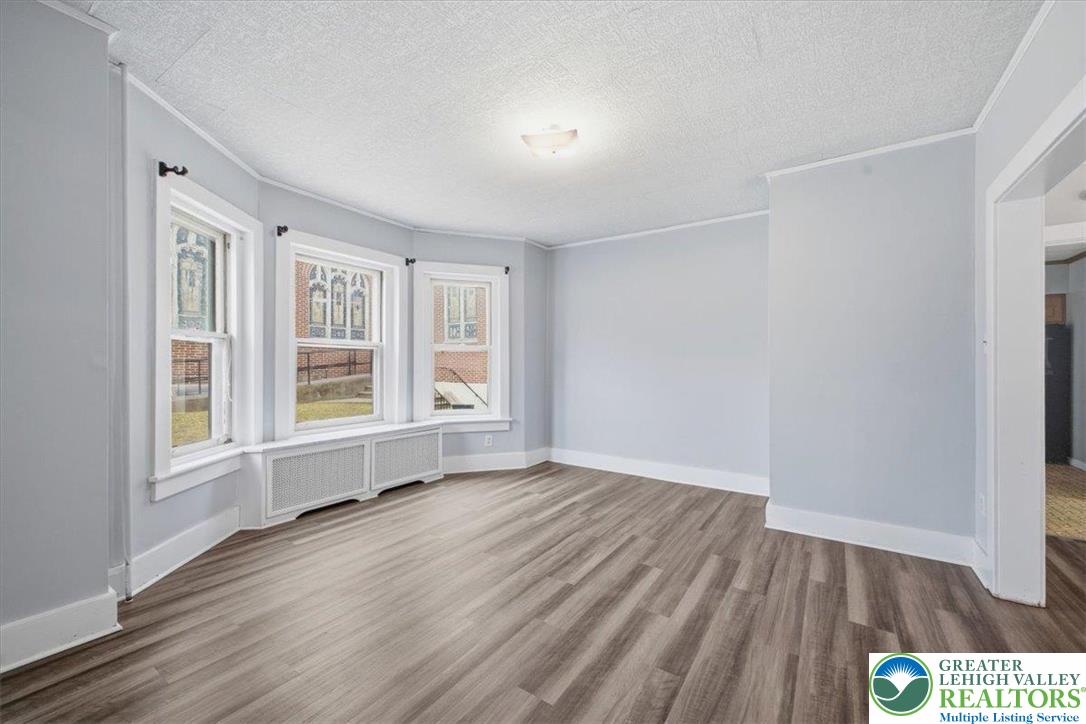 1229 Main Street Northampton, PA 18067 - Photo 9 of 24 an empty room with wooden floor and windows