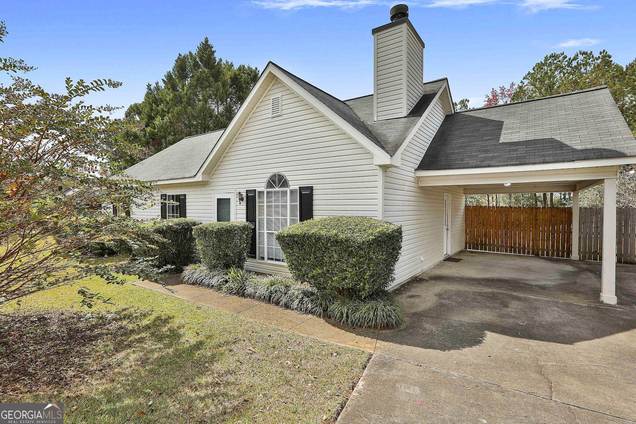 90 Ridge Drive Senoia, GA 30276 - Photo 1 of 1 a view of a house with a yard and potted plants