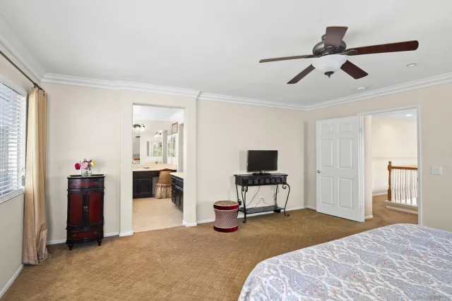 a bathroom with a tub sink shower and mirror
