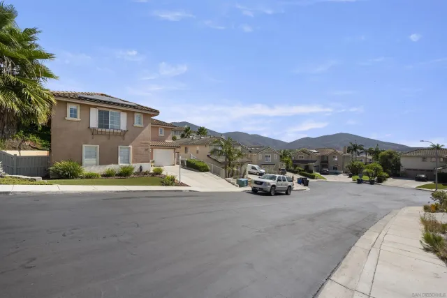 a view of a car parked on the side of the road