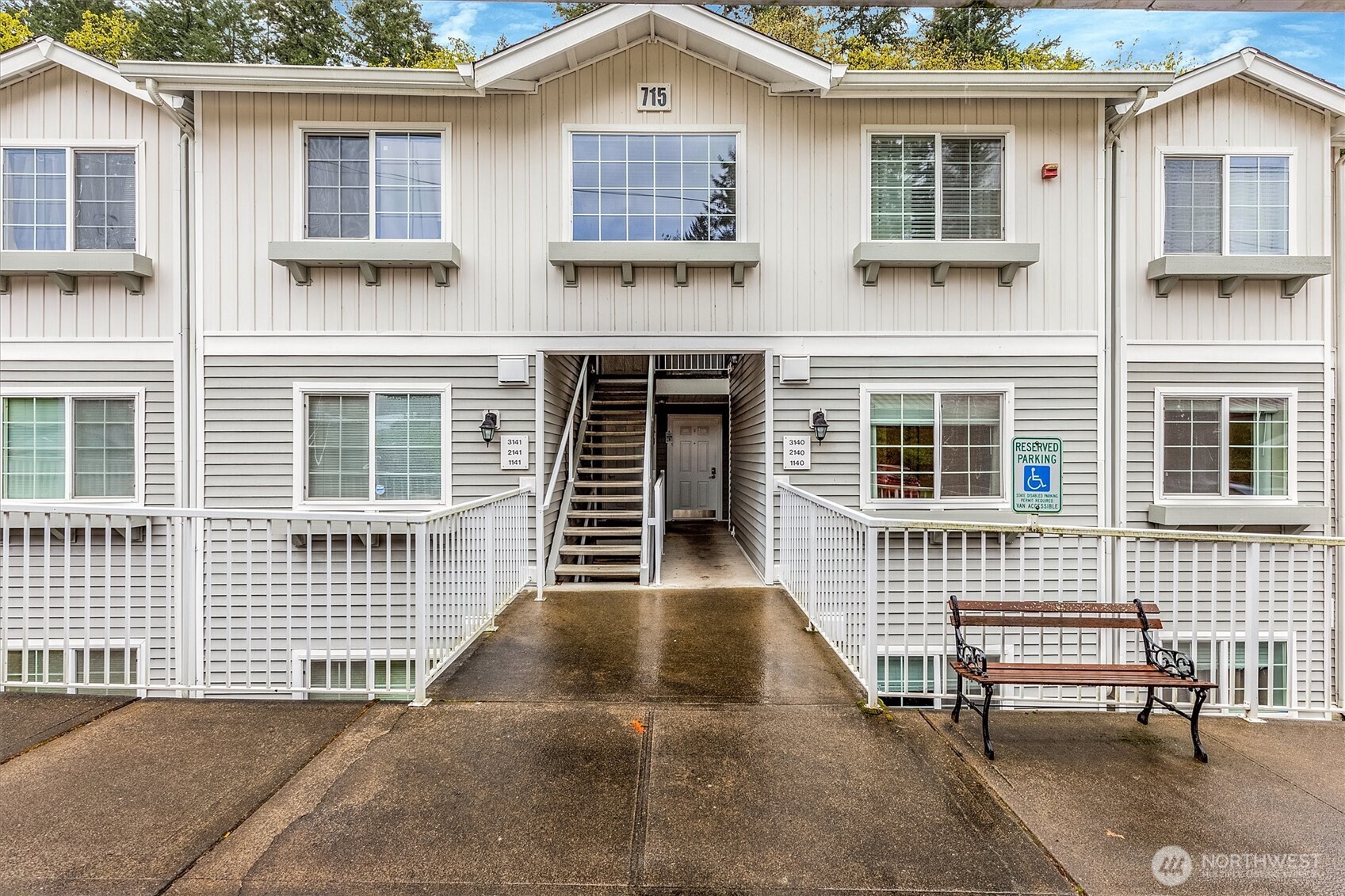 715 Harrington Place Southeast, Unit 2140 Renton, WA 98058 - Photo 1 of 36 a view of a brick house with many windows