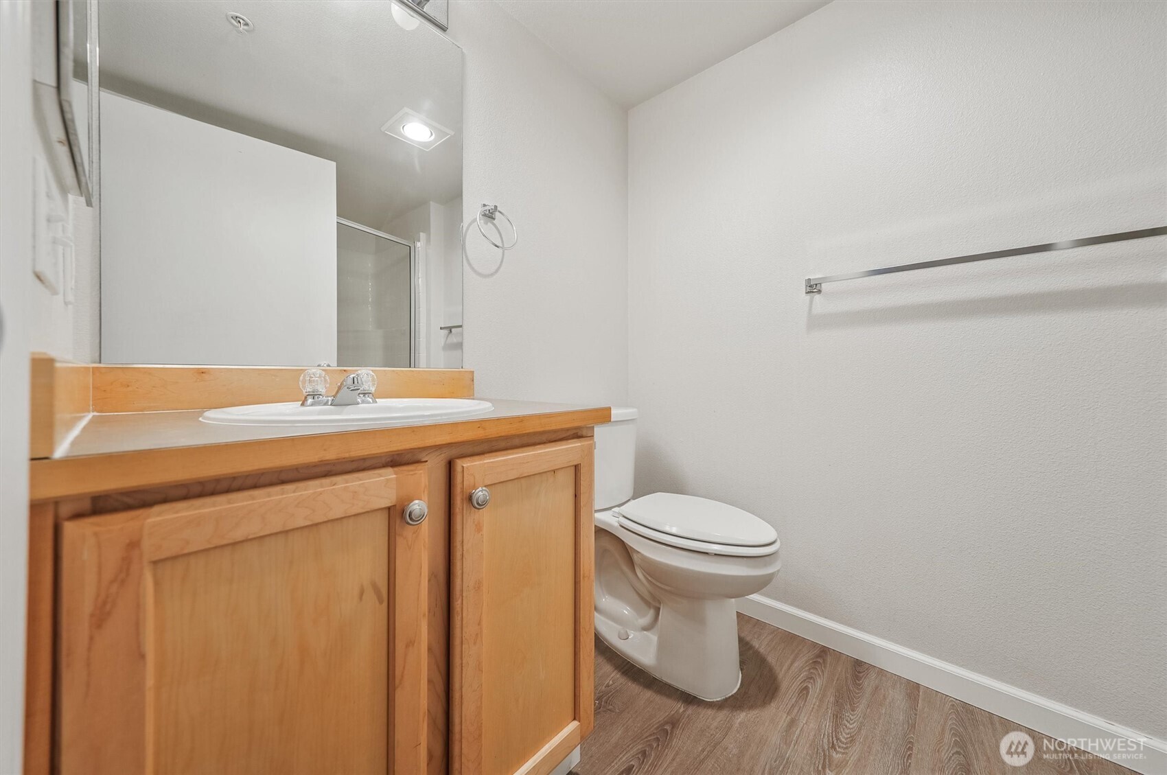 715 Harrington Place Southeast, Unit 2140 Renton, WA 98058 - Photo 22 of 36 a bathroom with a sink a toilet and a mirror