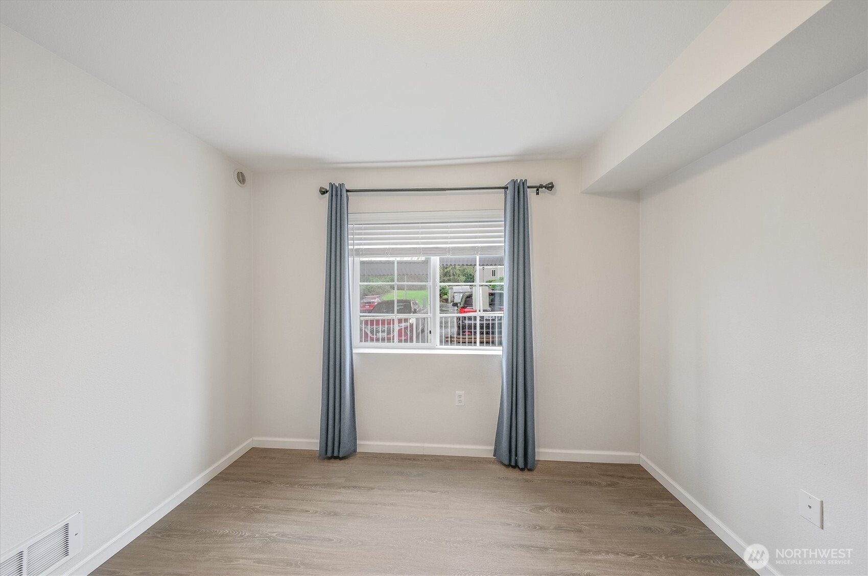 715 Harrington Place Southeast, Unit 2140 Renton, WA 98058 - Photo 29 of 36 an empty room with windows