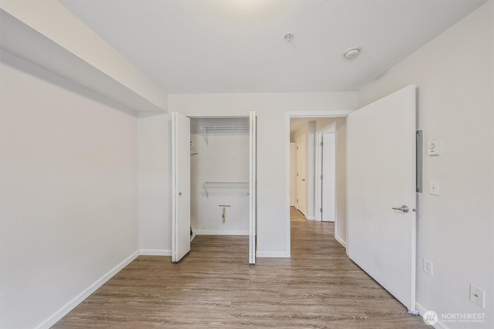 715 Harrington Place Southeast, Unit 2140 Renton, WA 98058 - Photo 30 of 36 a view of a hallway with wooden floor