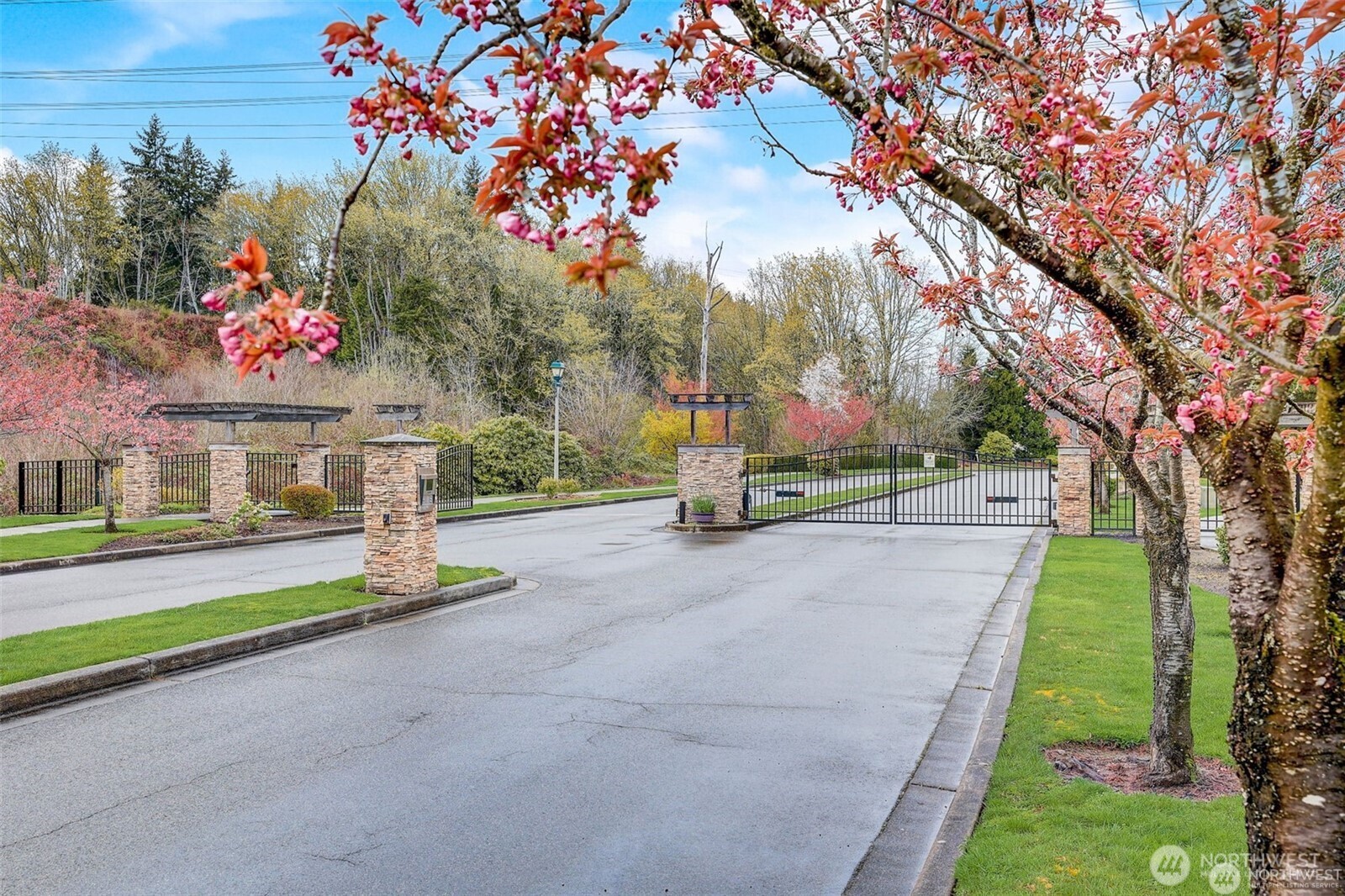715 Harrington Place Southeast, Unit 2140 Renton, WA 98058 - Photo 35 of 36 a view of a house with a yard and pathway