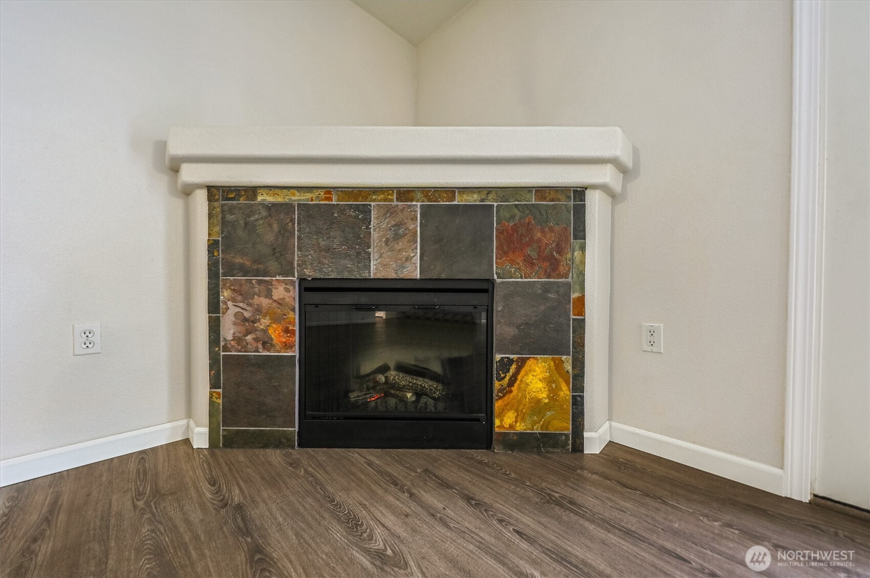715 Harrington Place Southeast, Unit 2140 Renton, WA 98058 - Photo 6 of 36 a living room with furniture and a fireplace