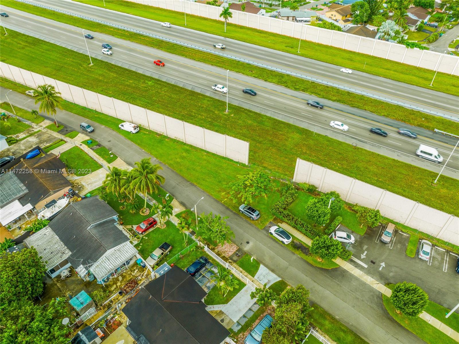 256 Sw Street Homestead, FL 33032 - Photo 4 of 12 a green field with lots of flower in it