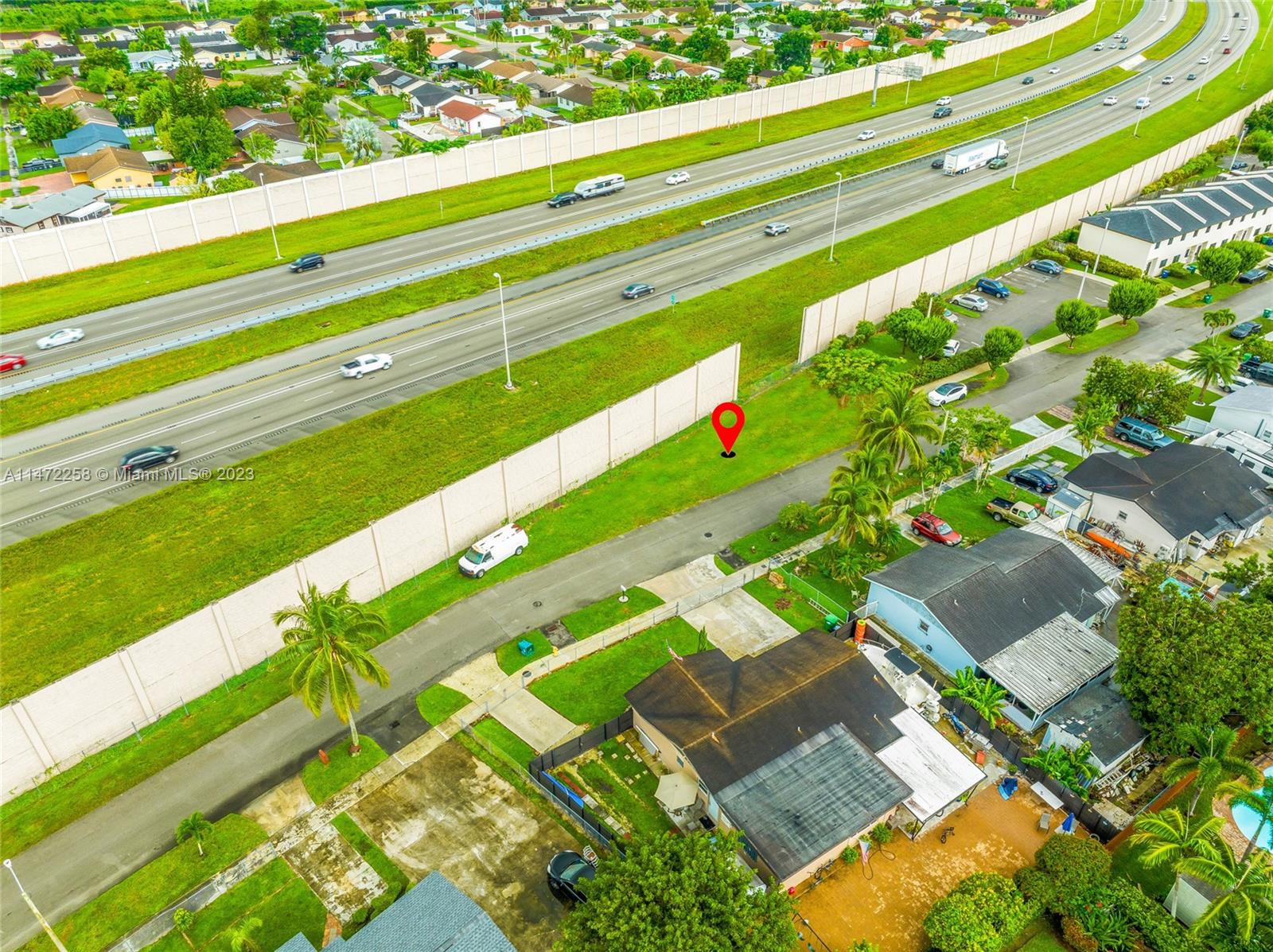 256 Sw Street Homestead, FL 33032 - Photo 9 of 12 a green field with lots of trees in the background