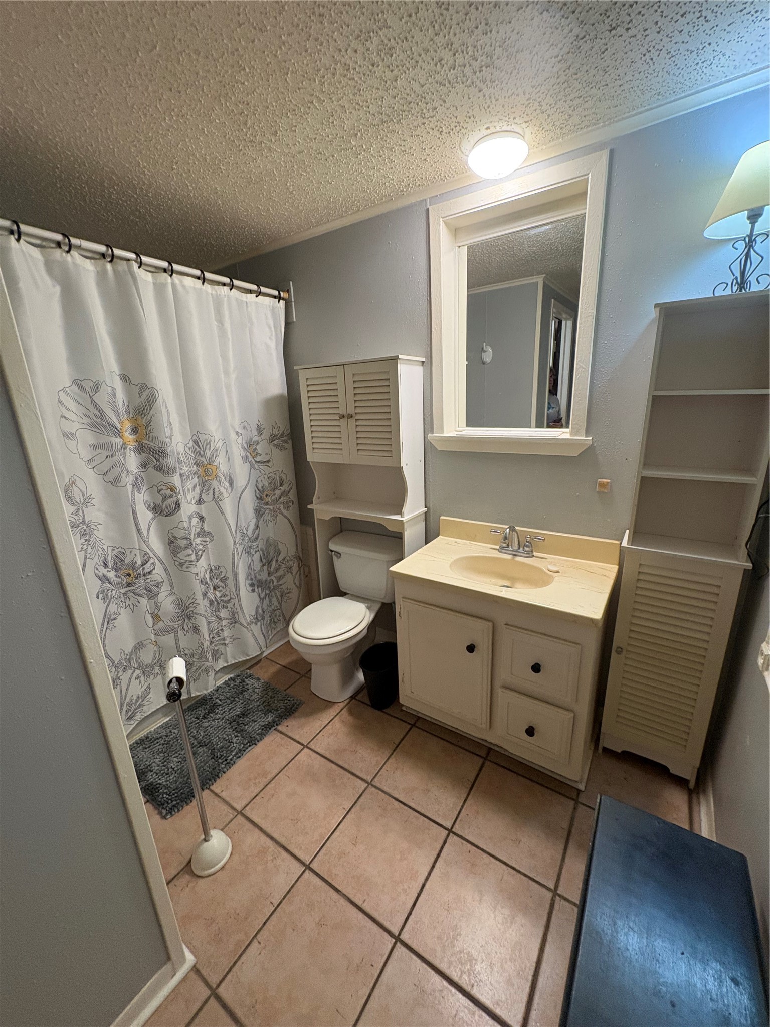 12505 Rollingwood Loop Conroe, TX 77303 - Photo 22 of 24 a spacious bathroom with a double vanity sink a mirror and a shower