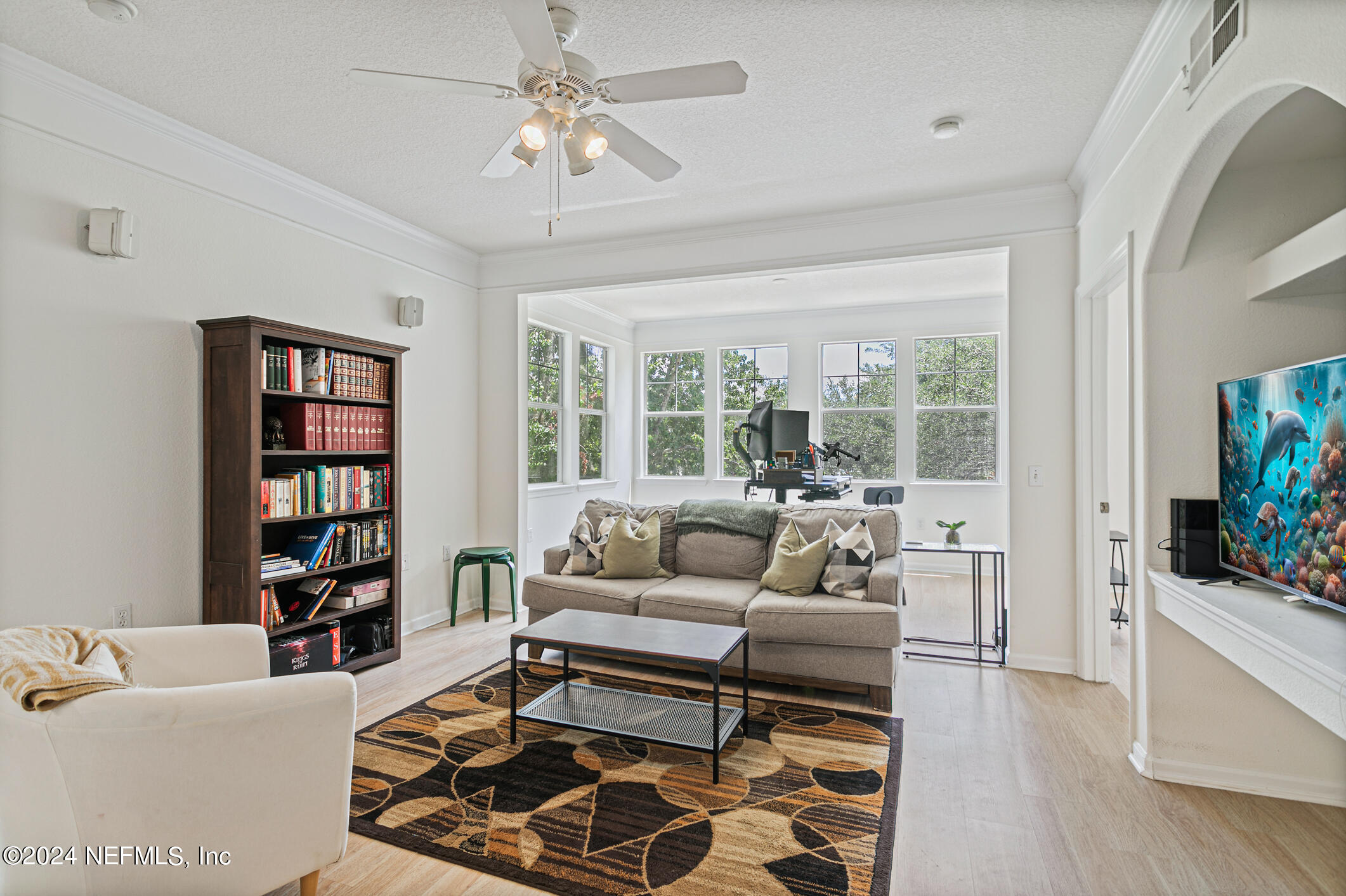 8550 Touchton Road, Unit 927 Jacksonville, FL 32216 - Photo 14 of 59 a living room with furniture and a flat screen tv