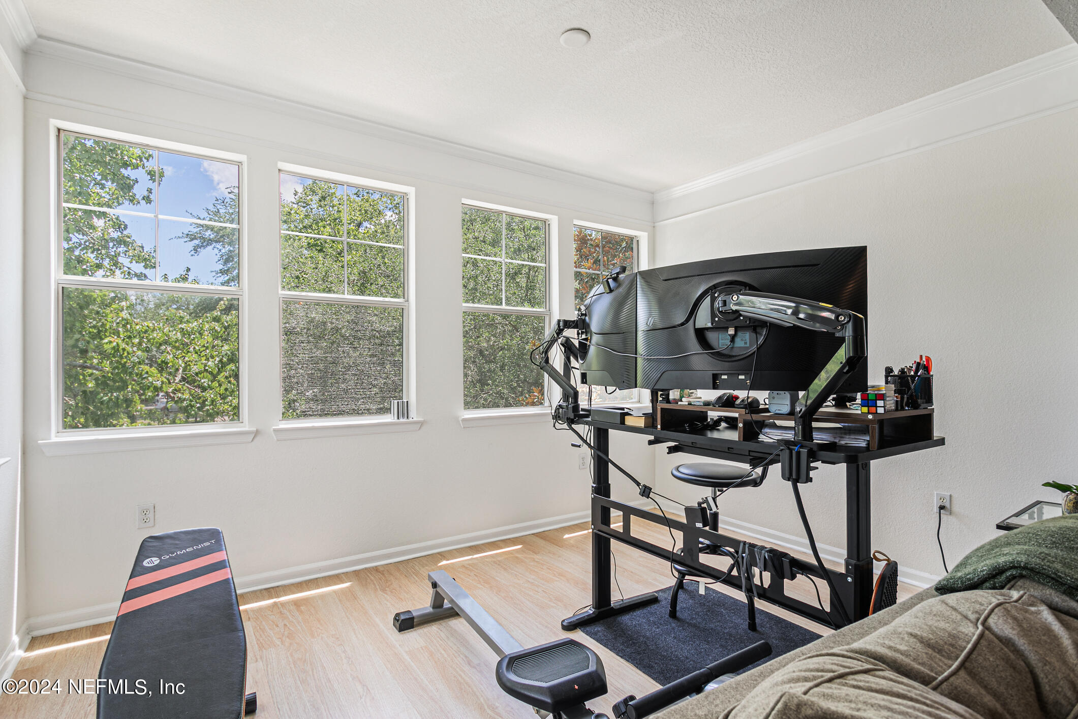 8550 Touchton Road, Unit 927 Jacksonville, FL 32216 - Photo 16 of 59 a living room with furniture a rug and a window