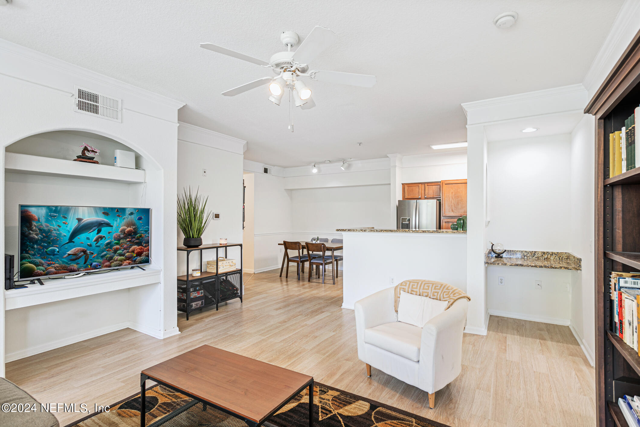 8550 Touchton Road, Unit 927 Jacksonville, FL 32216 - Photo 19 of 59 a living room with furniture and a flat screen tv