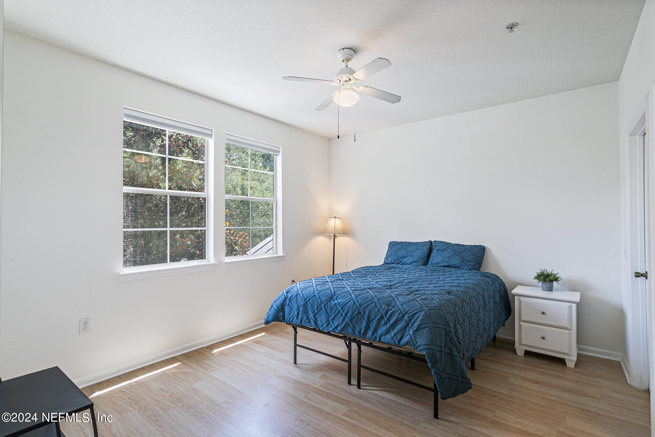 8550 Touchton Road, Unit 927 Jacksonville, FL 32216 - Photo 25 of 59 a bedroom with a bed and a table in it