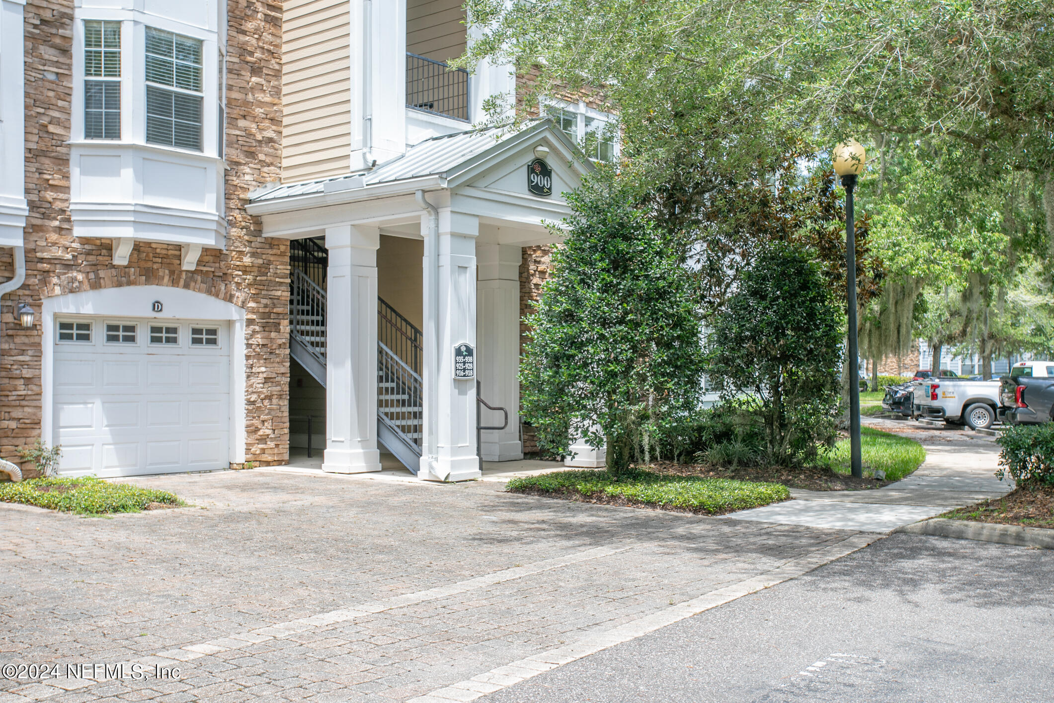 8550 Touchton Road, Unit 927 Jacksonville, FL 32216 - Photo 29 of 59 a front view of a house with garden