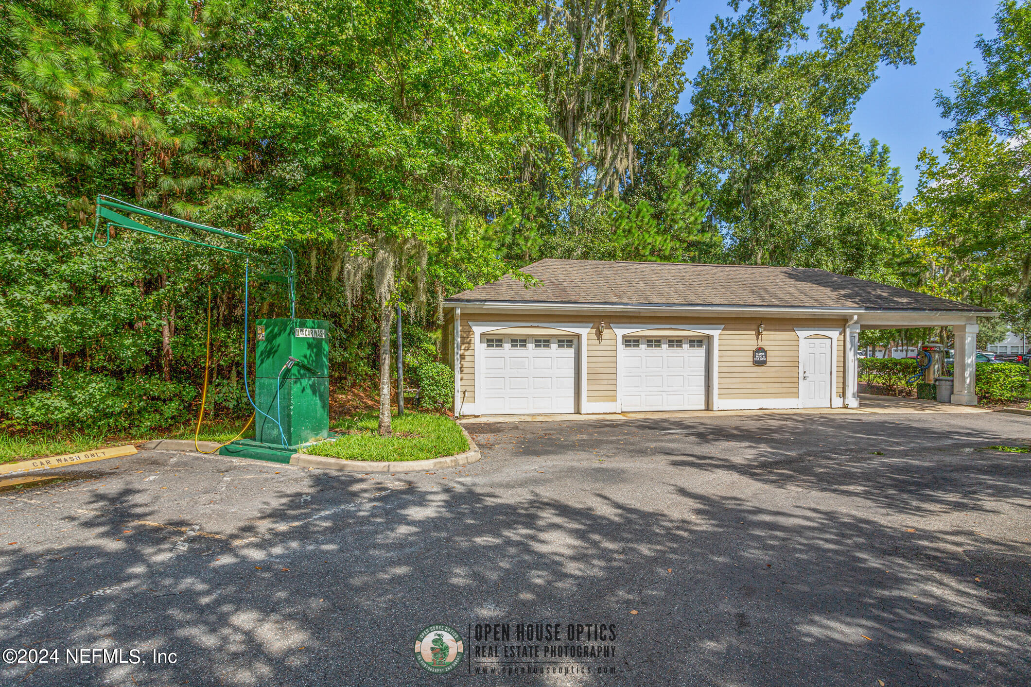 8550 Touchton Road, Unit 927 Jacksonville, FL 32216 - Photo 46 of 59 a yellow house with trees in front of it