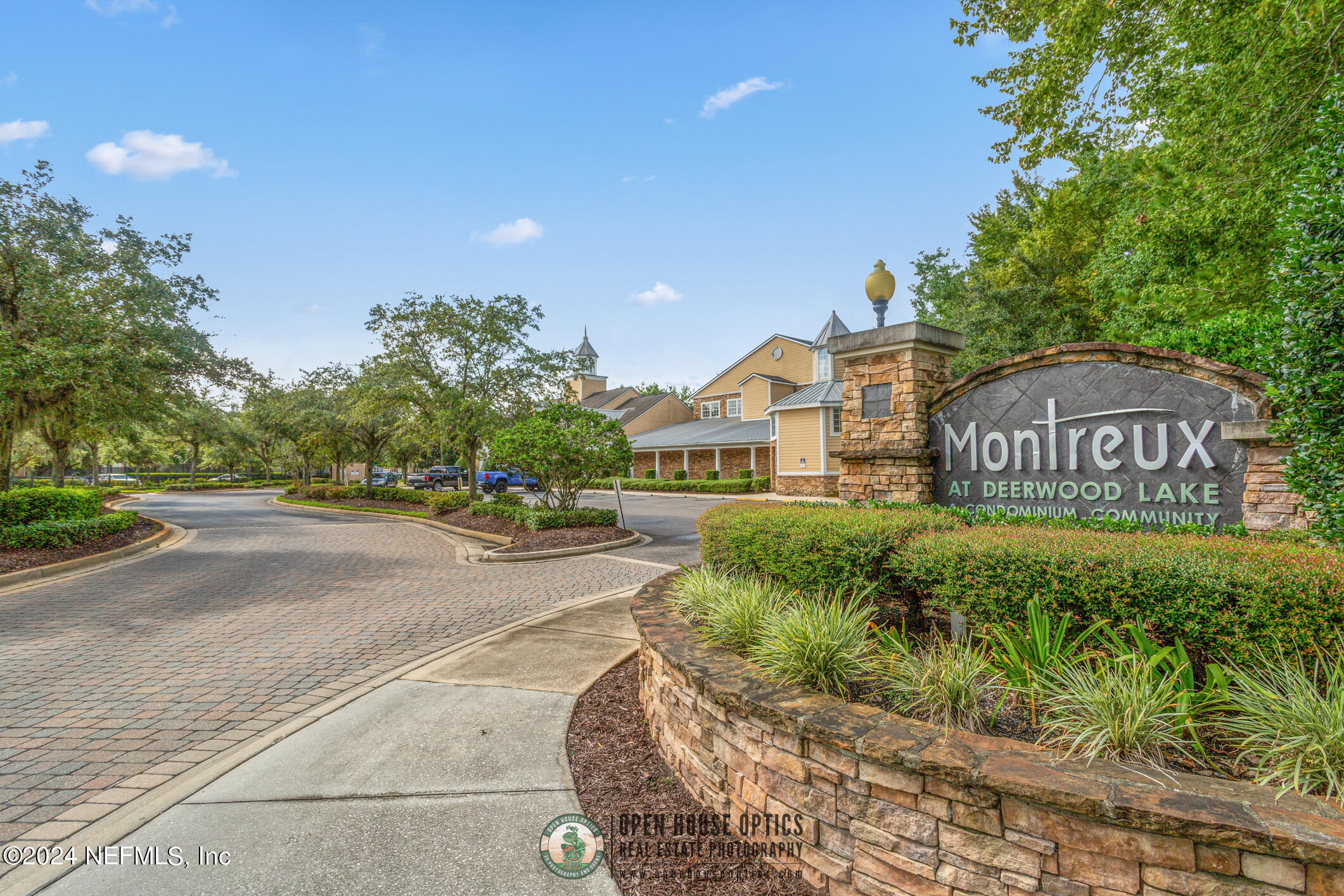 8550 Touchton Road, Unit 927 Jacksonville, FL 32216 - Photo 50 of 59 a front view of a house with a yard and potted plants