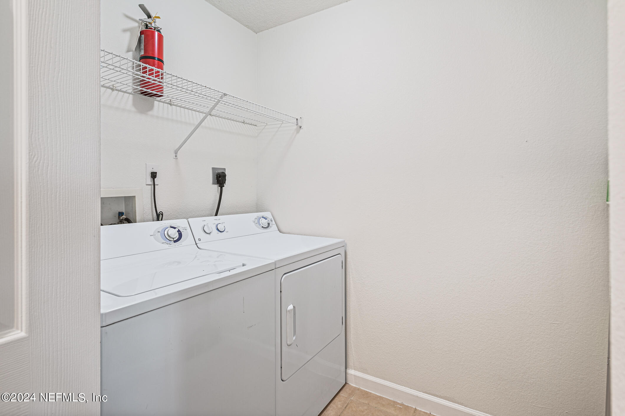 8550 Touchton Road, Unit 927 Jacksonville, FL 32216 - Photo 6 of 59 a utility room with dryer and washer