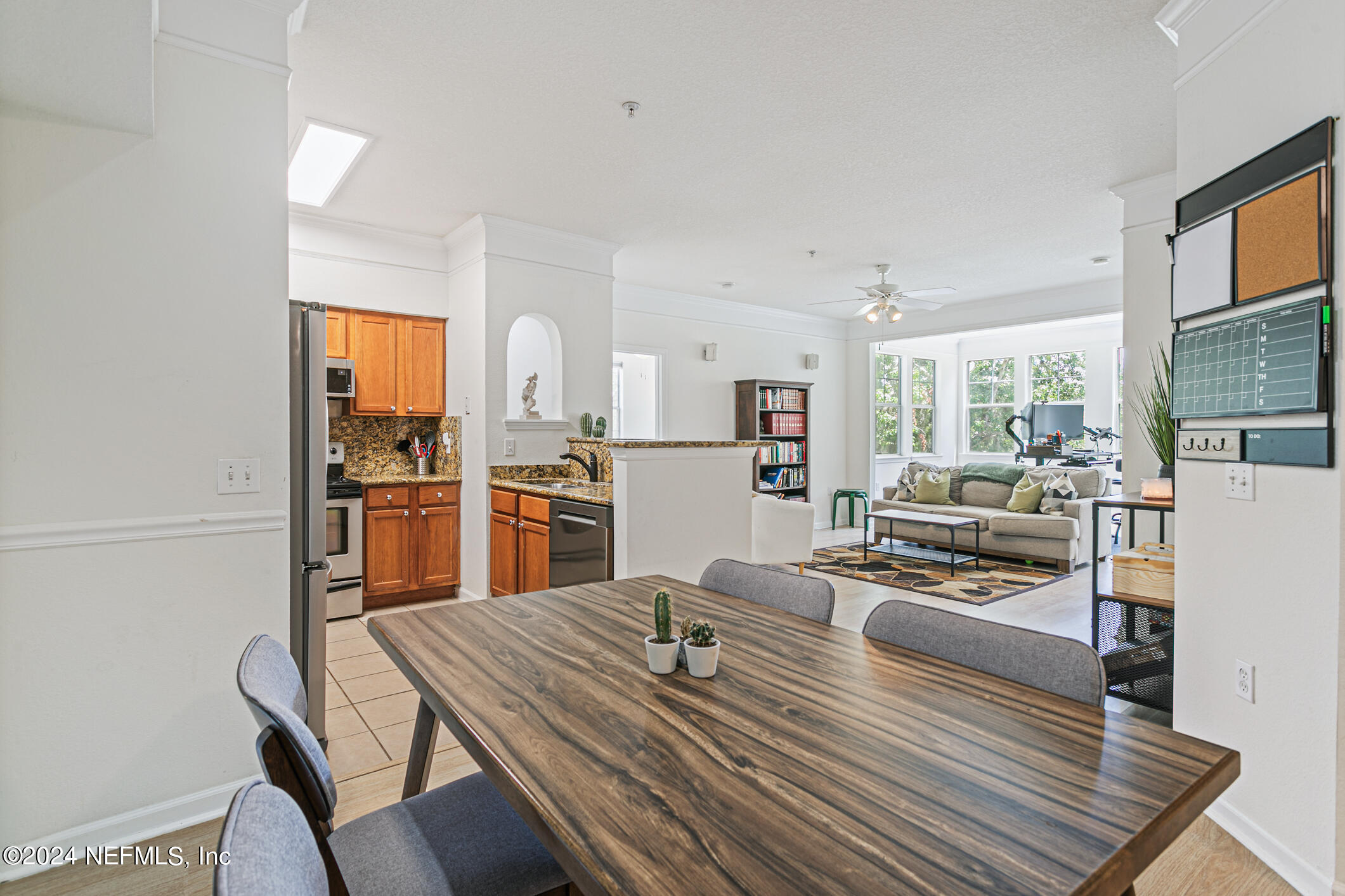 8550 Touchton Road, Unit 927 Jacksonville, FL 32216 - Photo 9 of 59 a living room with stainless steel appliances furniture stove and kitchen view