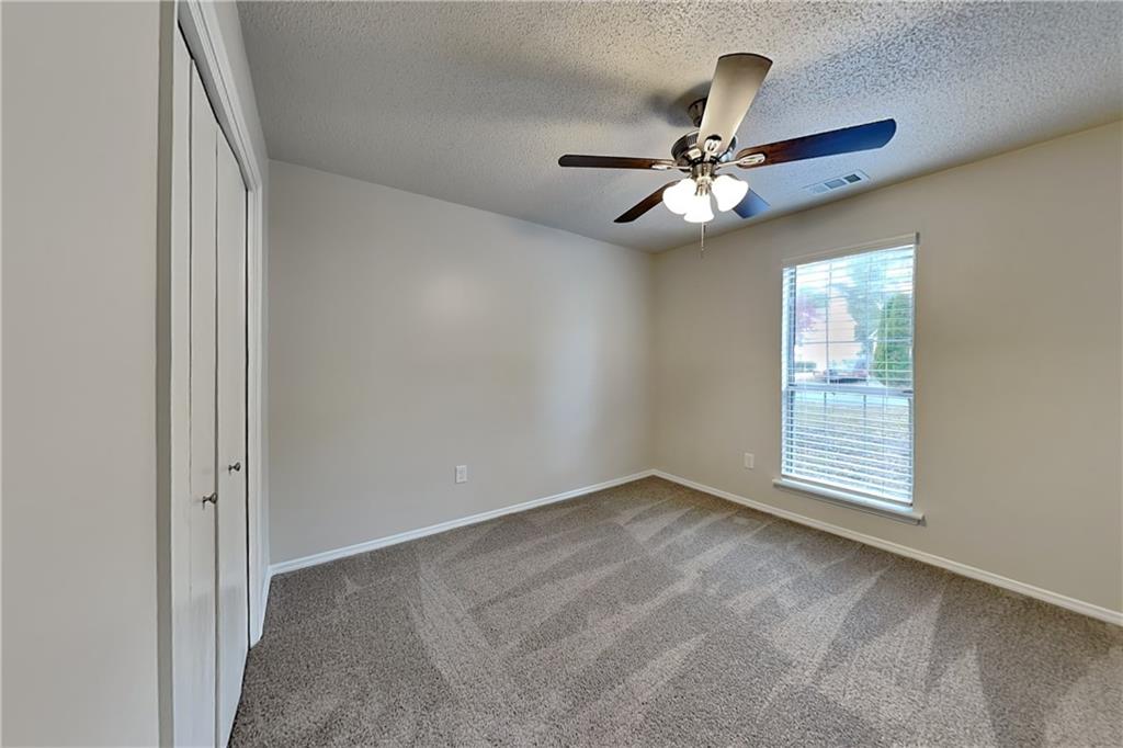 3979 Sharon Spring Powder Springs, GA 30127 - Photo 13 of 18 an empty room with windows and fan