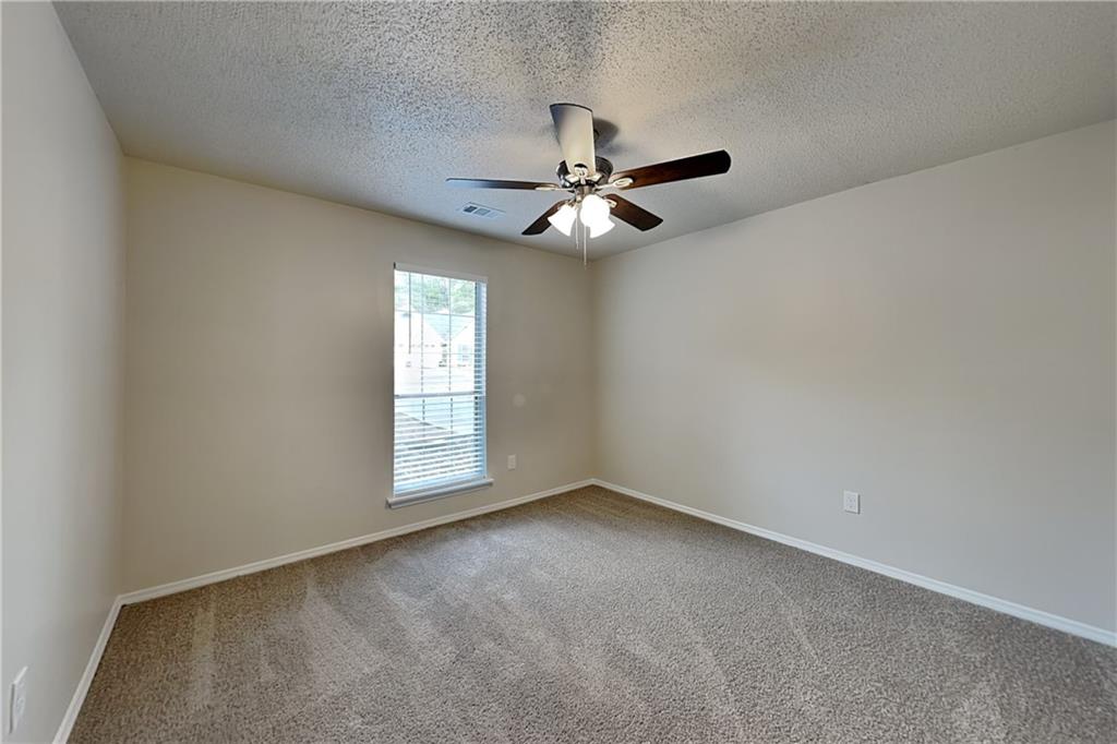 3979 Sharon Spring Powder Springs, GA 30127 - Photo 14 of 18 an empty room with windows and fan