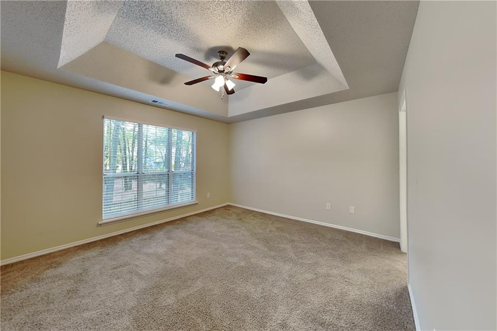 3979 Sharon Spring Powder Springs, GA 30127 - Photo 8 of 18 an empty room with windows and fan