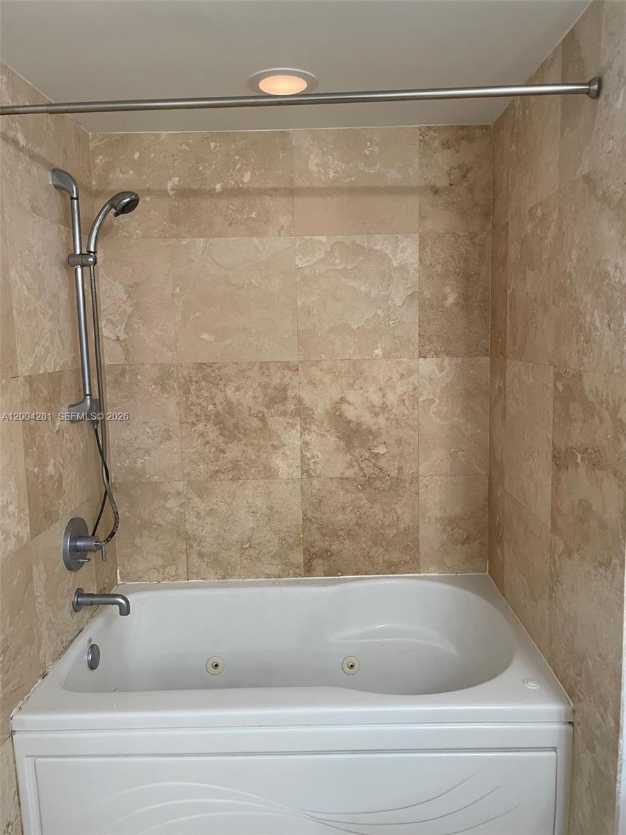 41 Southeast 5th Street, Unit 1614 Miami, FL 33131 - Photo 13 of 23 a bathroom with a shower and a sink