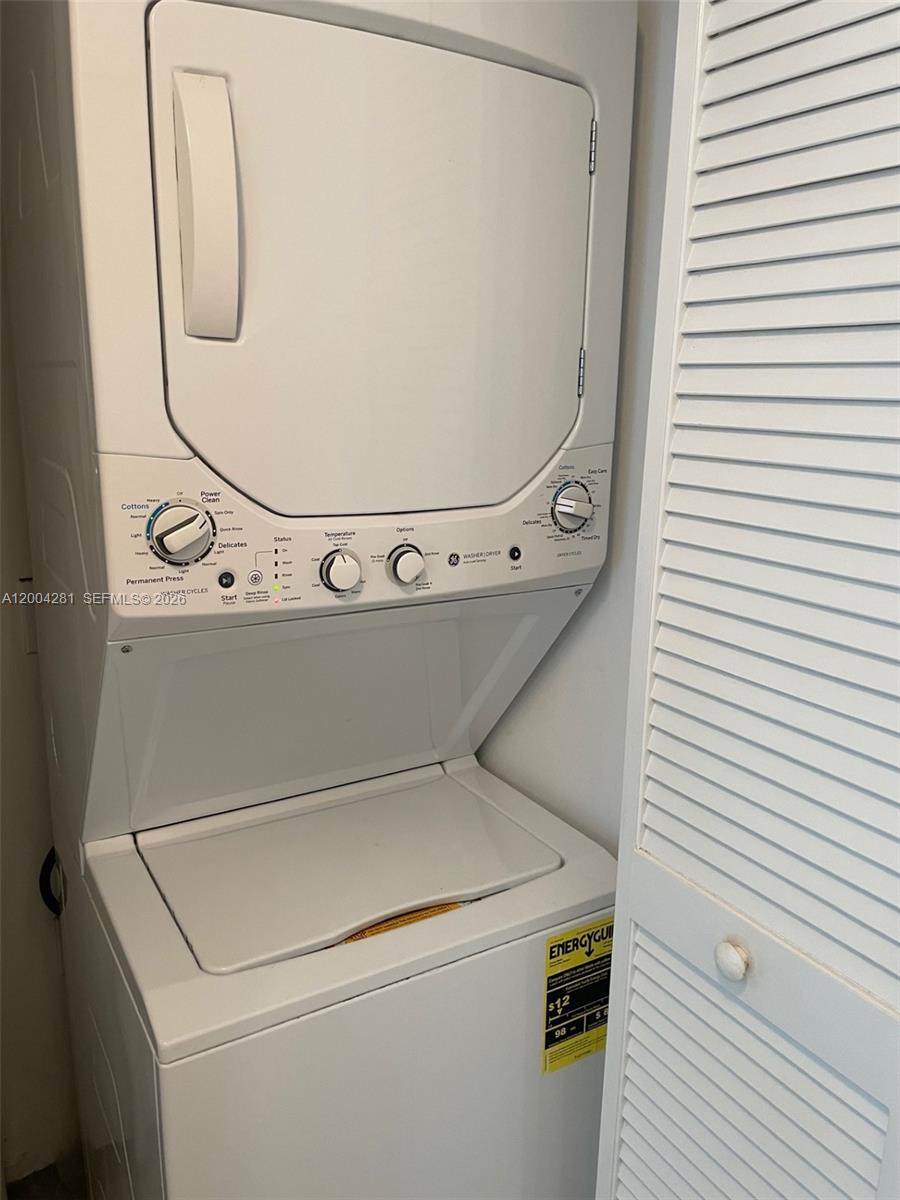 41 Southeast 5th Street, Unit 1614 Miami, FL 33131 - Photo 16 of 23 a utility room with dryer and washer