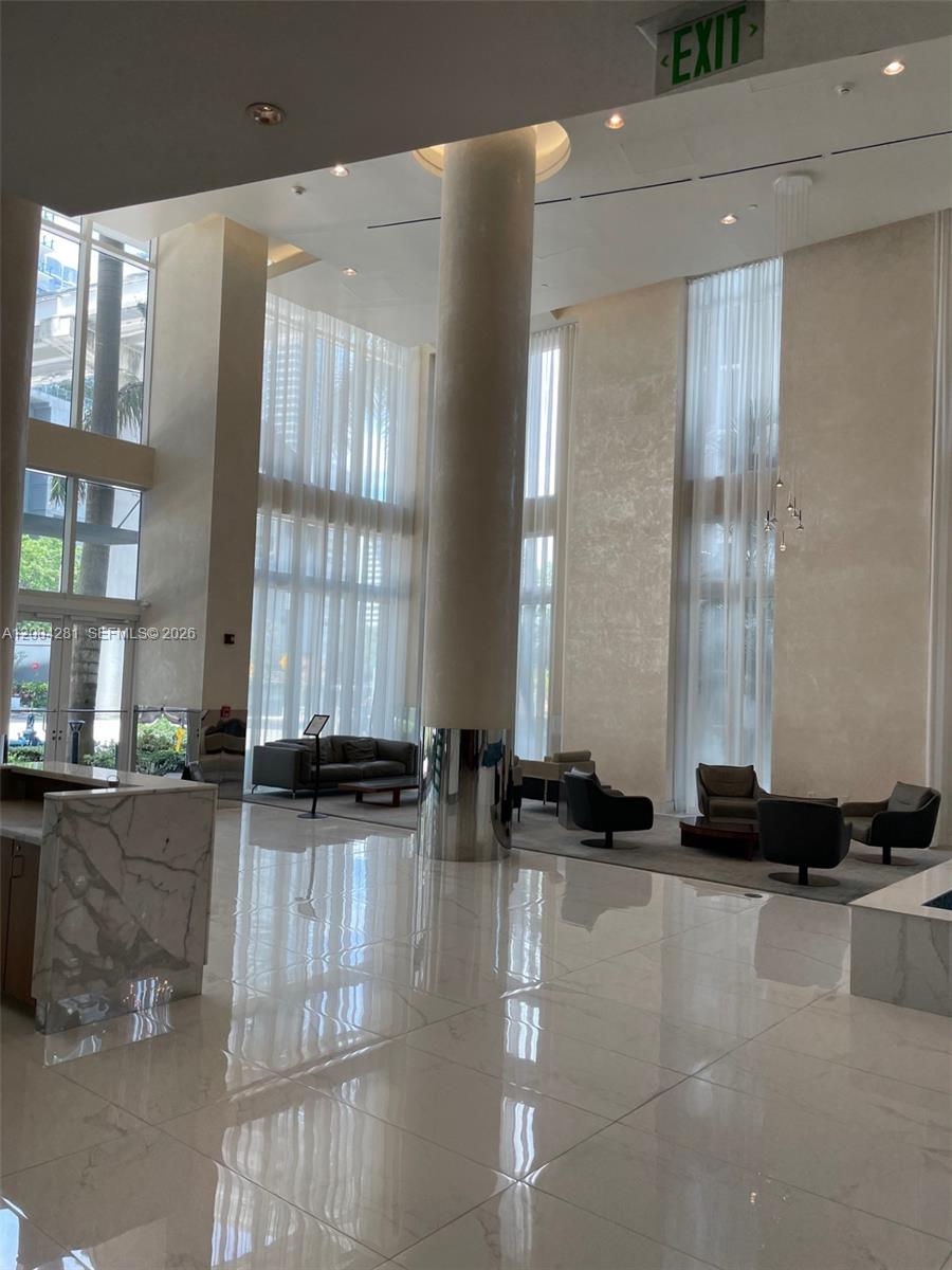 41 Southeast 5th Street, Unit 1614 Miami, FL 33131 - Photo 4 of 23 a view of a lobby with black and white walls