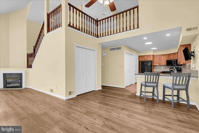a view of a livingroom with furniture and hardwood floor