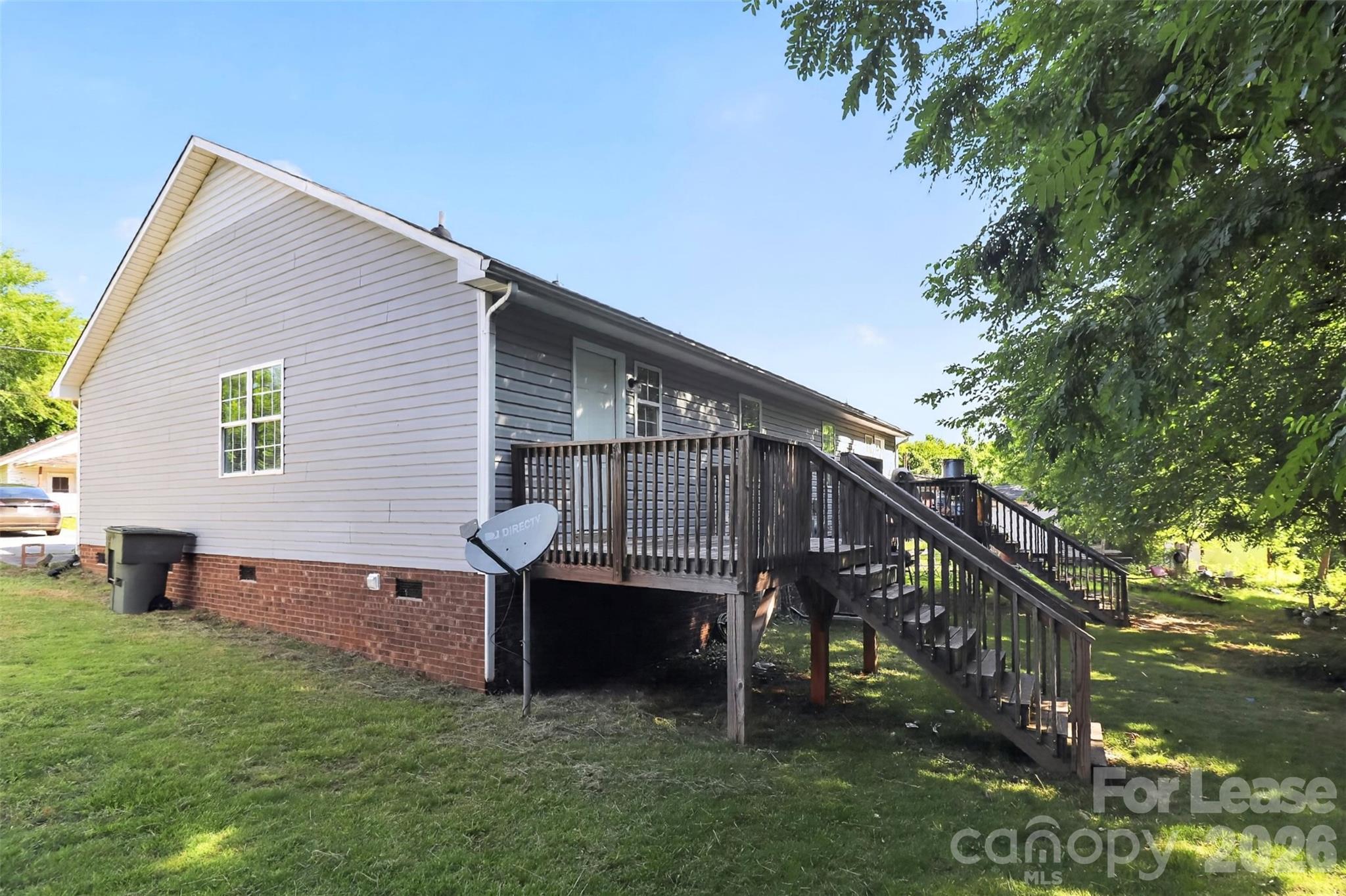 91-93 Sunderland Road Southwest, Unit 93 Concord, NC 28027 - Photo 27 of 30 a view of backyard with deck and outdoor seating