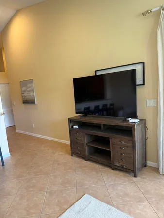 a room with furniture and flat screen tv