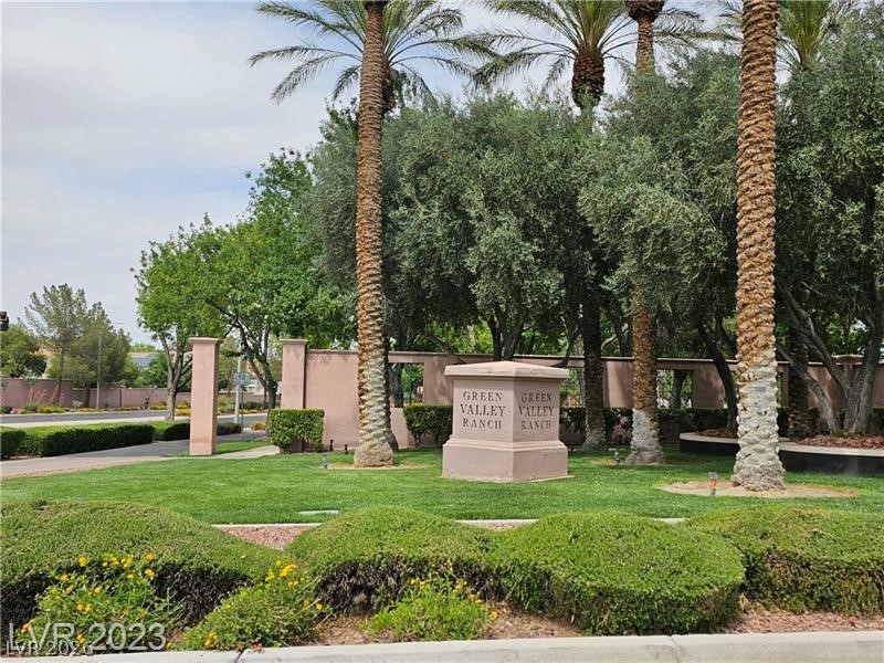 285 Spring Palms Street Henderson, NV 89012 - Photo 33 of 38 Community sign with a lawn