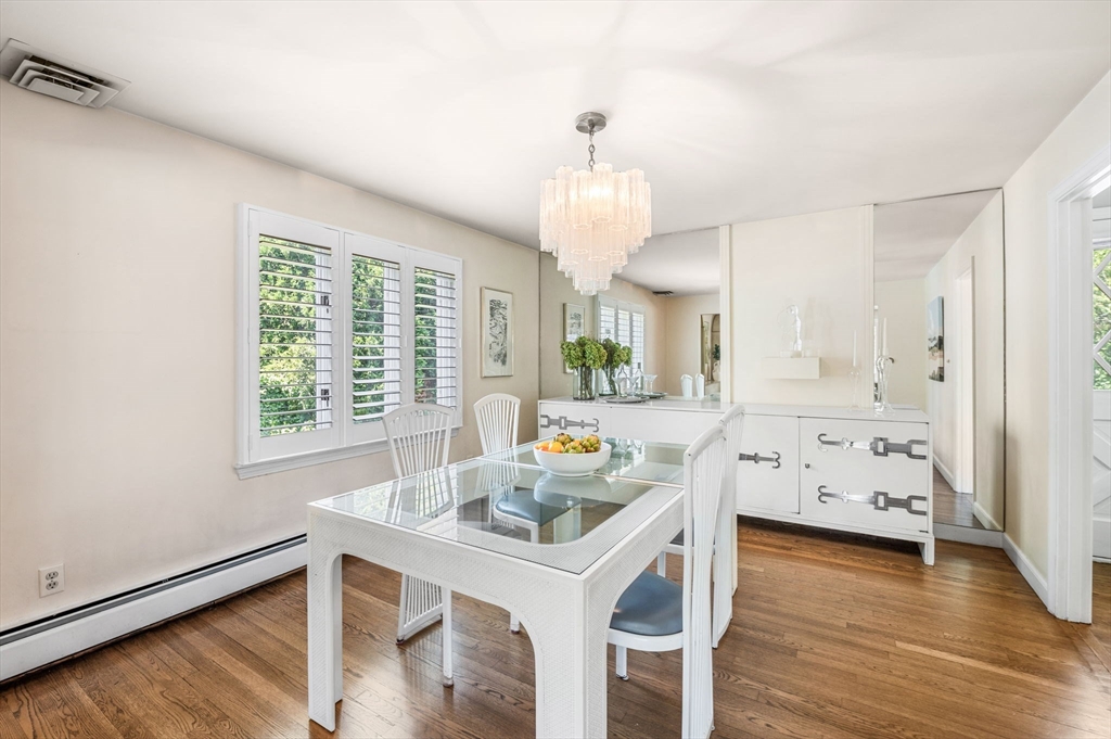 24 Gerald Road Marblehead, MA 01945 - Photo 7 of 37 a kitchen with stainless steel appliances a table and chairs