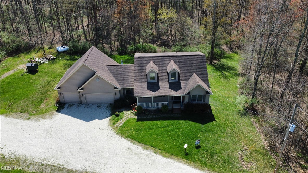 6020 Factor Road Southwest Sherrodsville, OH 44675 - Photo 37 of 39 Bird's eye view featuring a forest view