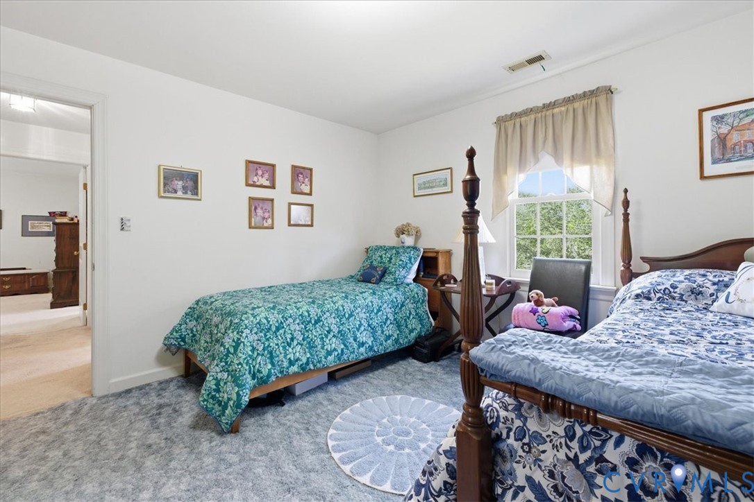 15414 Sunnybrook Road Petersburg, VA 23805 - Photo 25 of 29 a bedroom with two beds and wooden floor