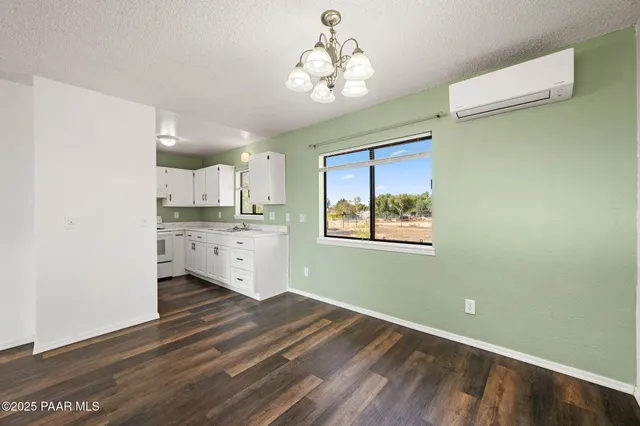 a view of a kitchen with wooden floor