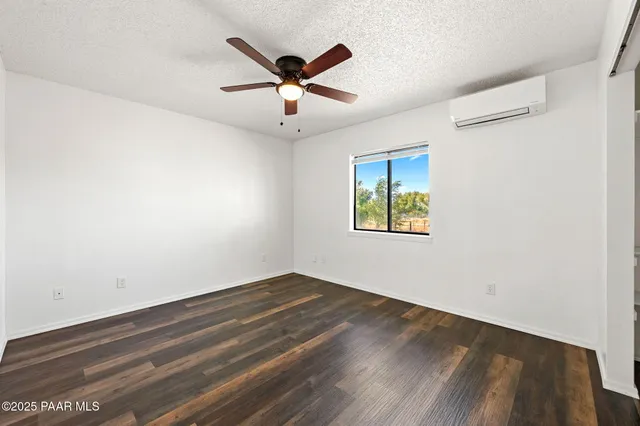 a bedroom with bed and a window