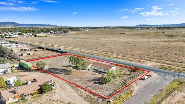 a view of an empty room and a window