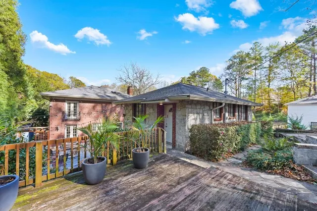 a view of a house with yard and a garden