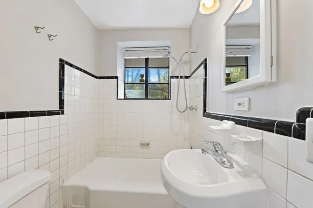 a bathroom with a sink and a bathtub