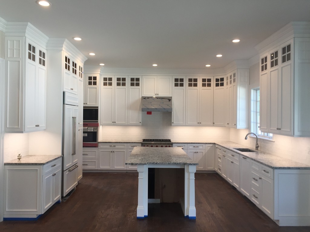 7 Marshall Road Wellesley, MA 02482 - Photo 13 of 29 a kitchen with kitchen island granite countertop a sink and refrigerator