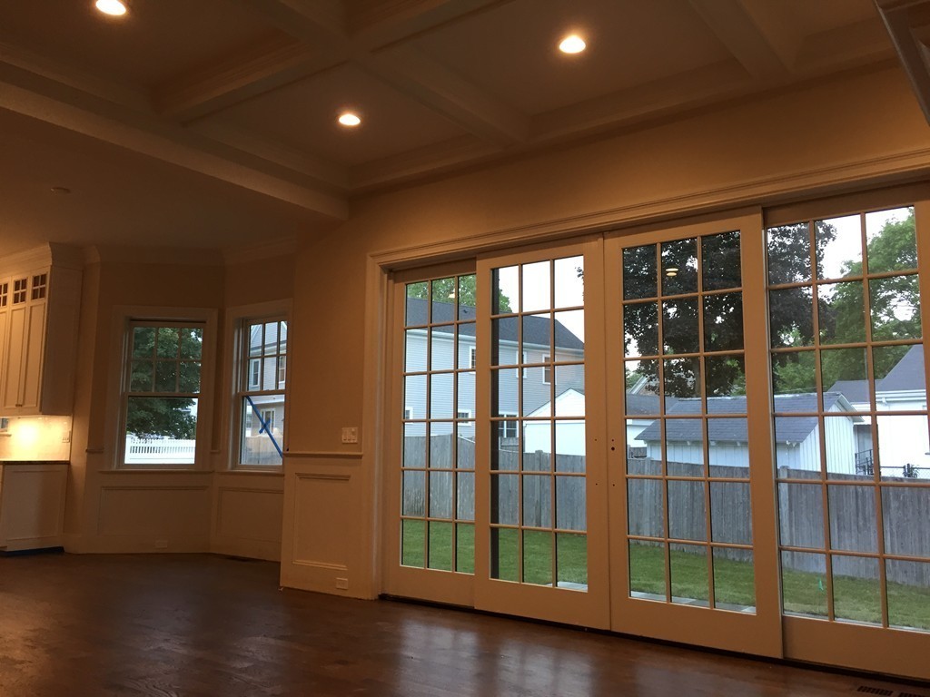 7 Marshall Road Wellesley, MA 02482 - Photo 15 of 29 a view of an empty room with wooden floor and windows