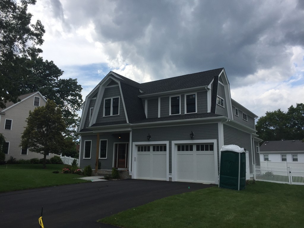 7 Marshall Road Wellesley, MA 02482 - Photo 2 of 29 a front view of a house with a garden