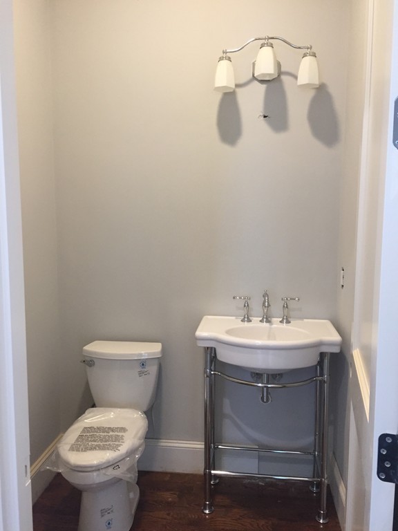 7 Marshall Road Wellesley, MA 02482 - Photo 21 of 29 a bathroom with a toilet a sink and mirror