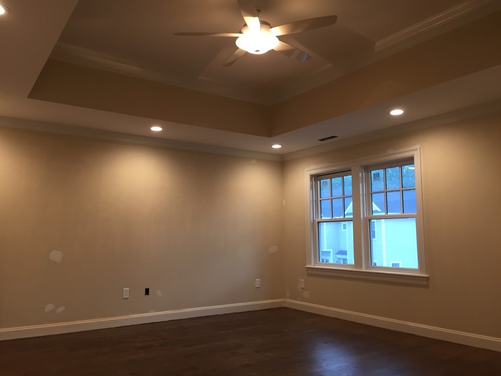 7 Marshall Road Wellesley, MA 02482 - Photo 22 of 29 a view of empty room with wooden floor and fan