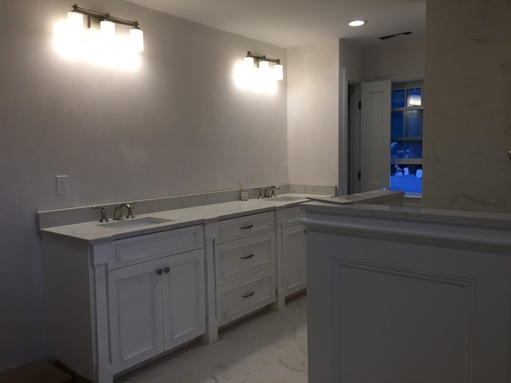 7 Marshall Road Wellesley, MA 02482 - Photo 24 of 29 a bathroom with a sink and a mirror